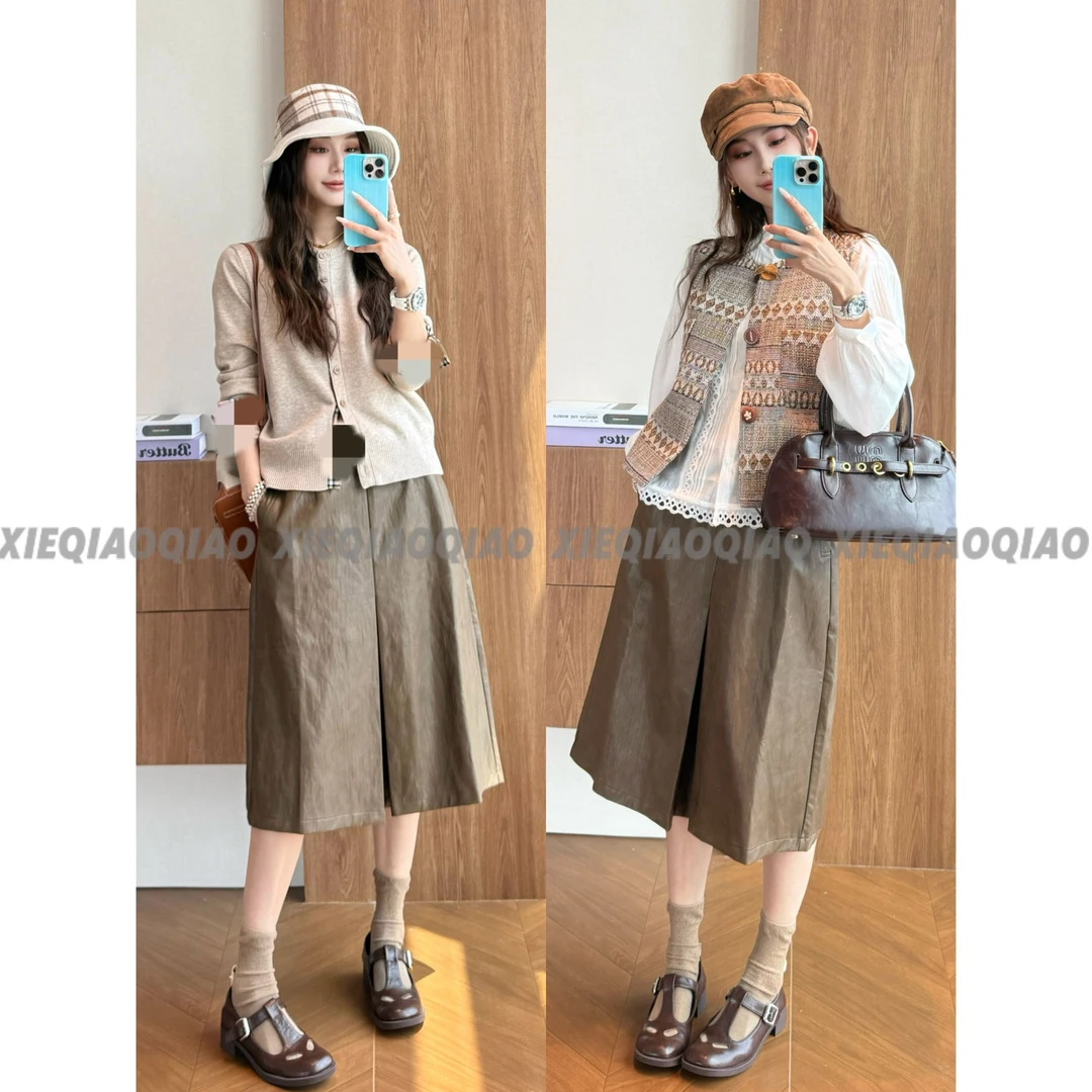 谢荞荞「曼城魅影」早秋款小众设计前开叉带皮带A字中长款半身皮裙