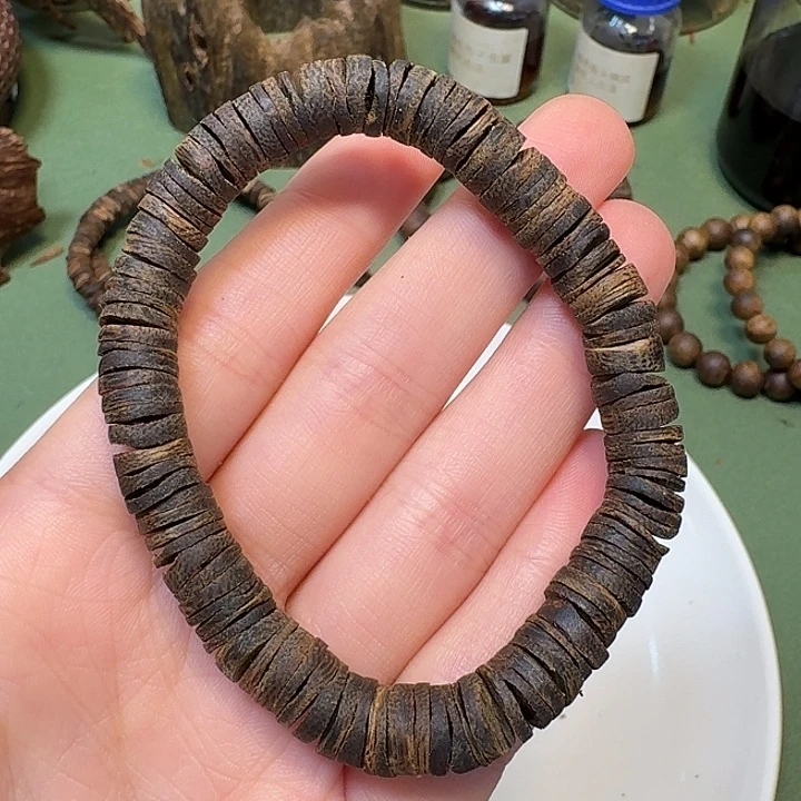 沉香沉香碎屑海南高端紫棋皮油沉水老料9克