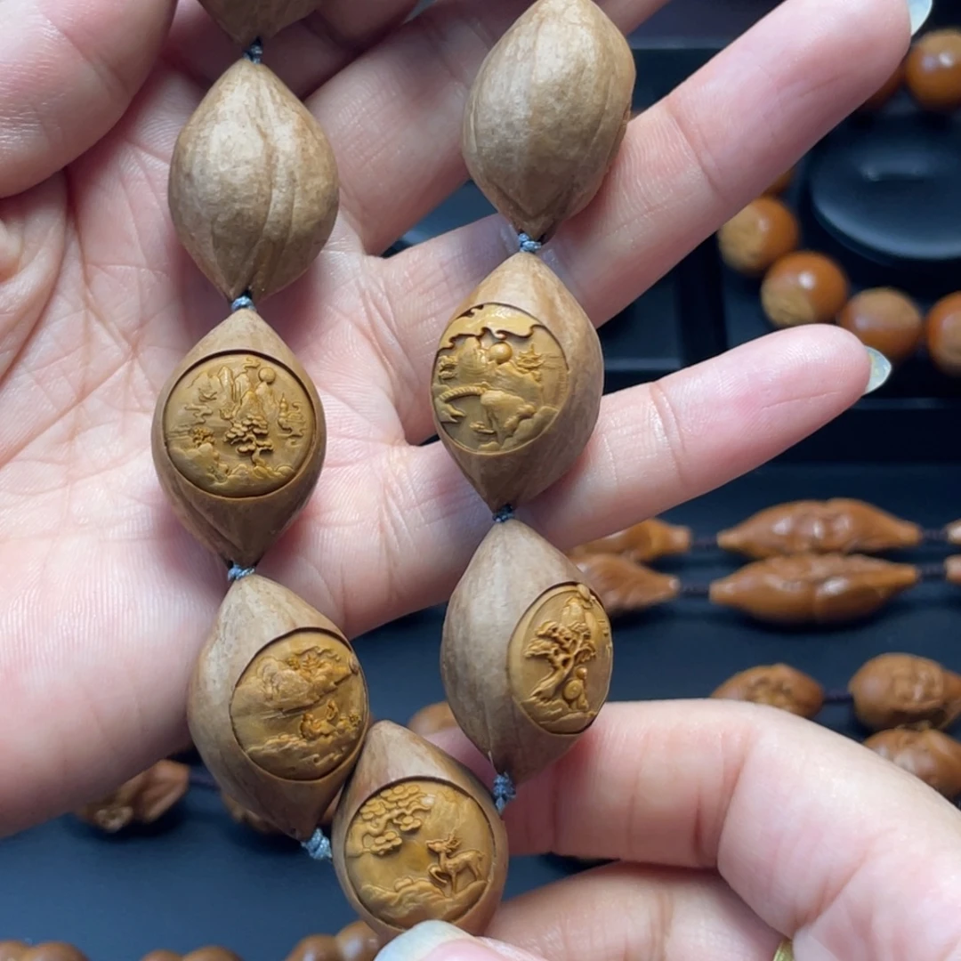 宇***游橄榄核手串/手链包衣万里江山