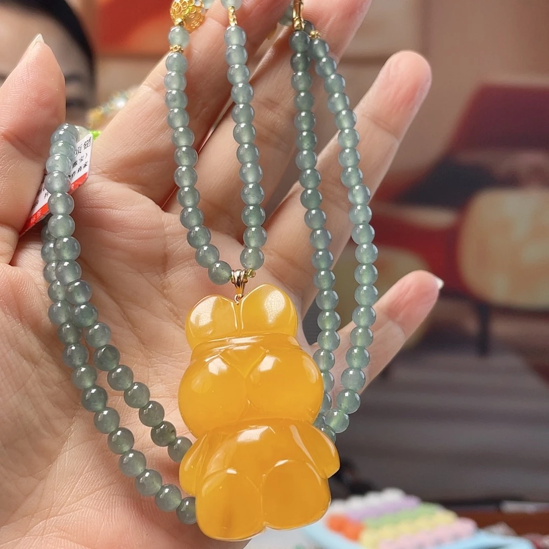 溜***糖裸石蜜蜡18K金镶嵌蜜蜡吊坠