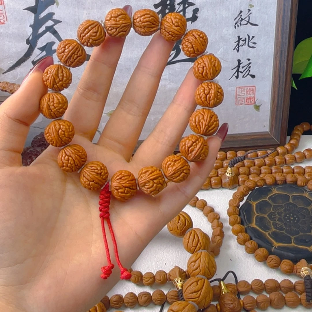 小****秦岭龙纹桃核手串