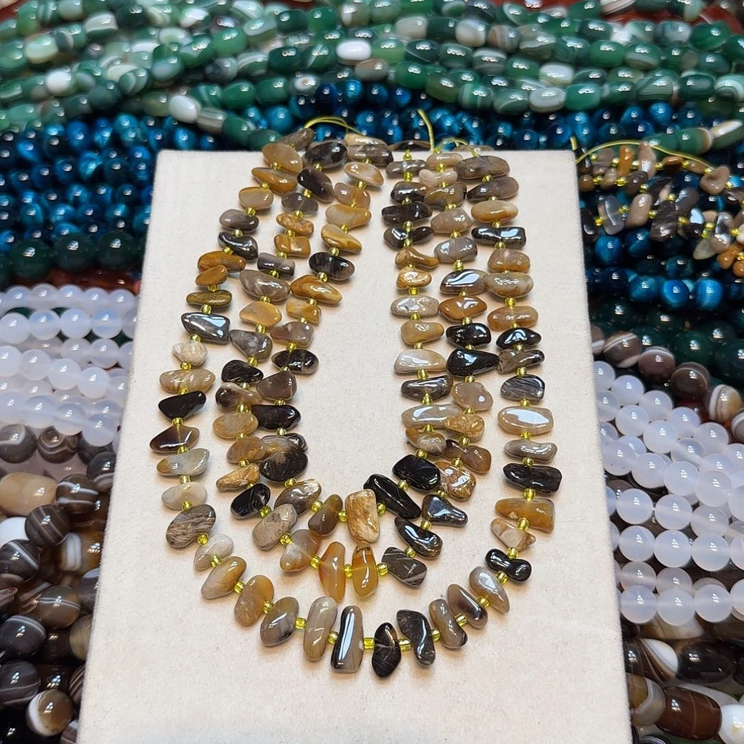 玛瑙/玉髓未镶嵌珠宝半成品天然花澳宝中孔一条