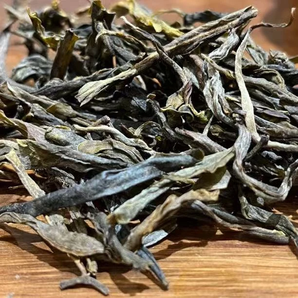 老曼峨精选古树黑条生茶100克