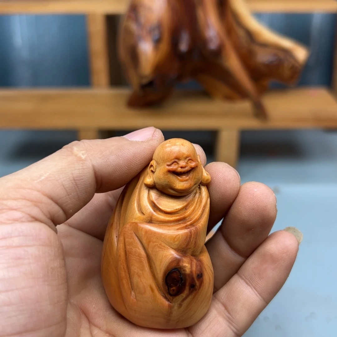 秦***臻木崖柏木摆件手把件