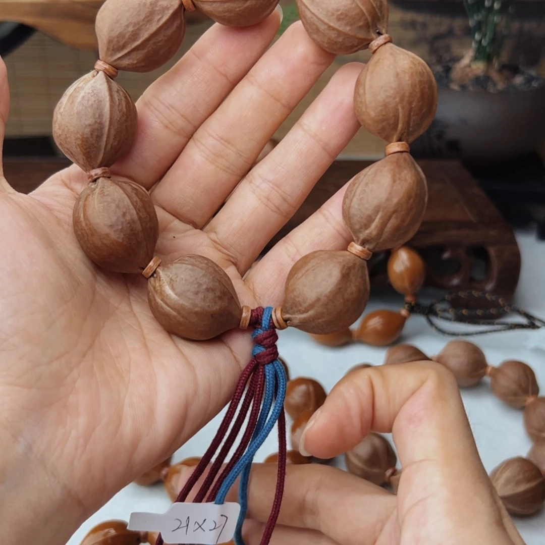 C***Y橄榄核手串21*27三花核串