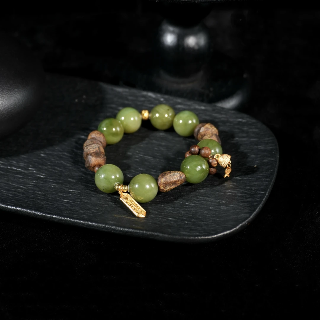 F084 和田玉银925镶嵌 黑羊洞12mm圆珠金色小铃铛手串 孔道小打磨