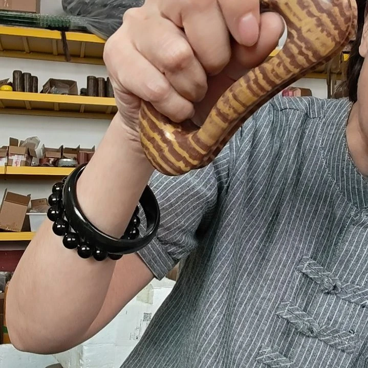 泗水砭石文化馆生物电乾坤推手把件