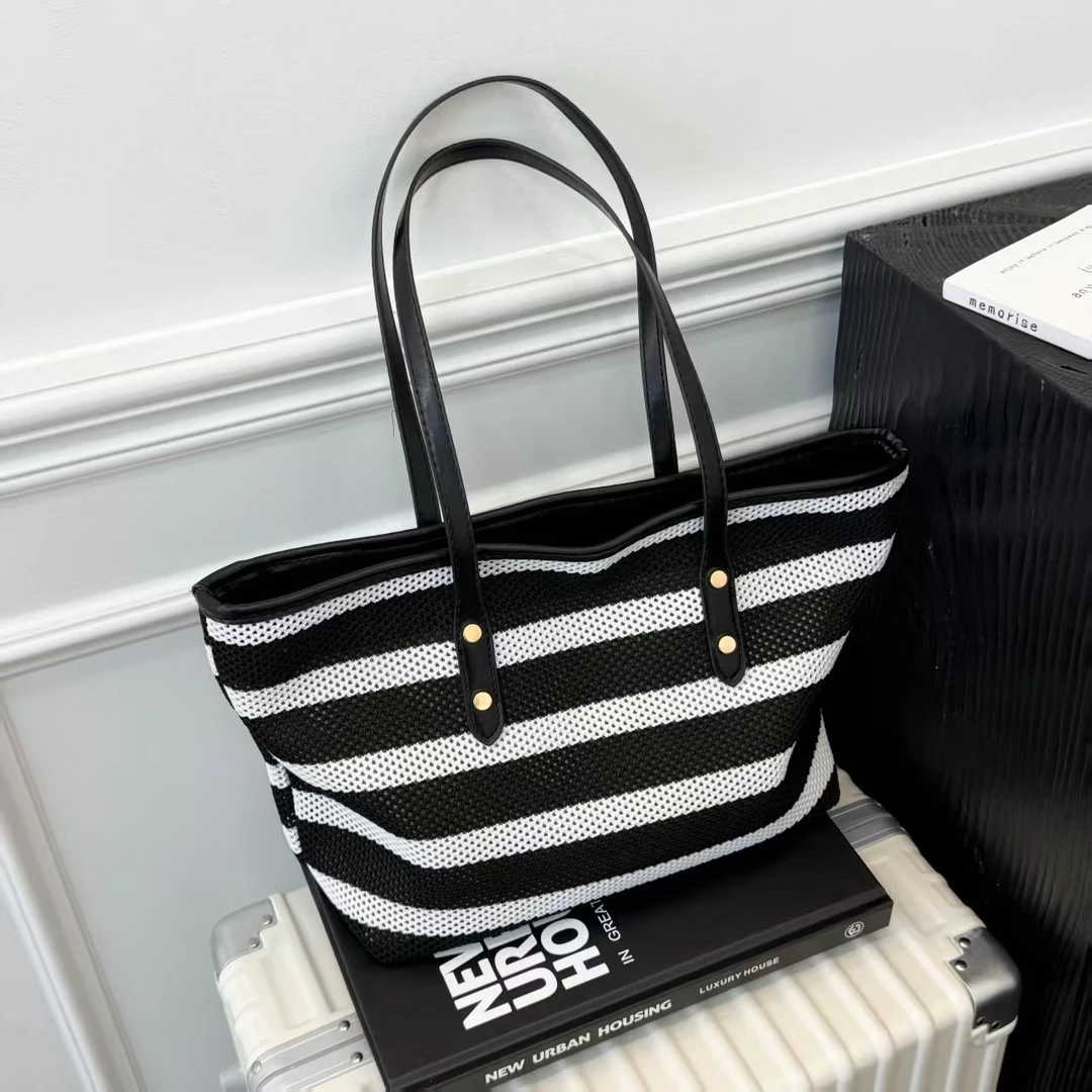 黑白条纹镂空编织包包女2025新款百搭腋下包时尚单肩托特包沙滩包