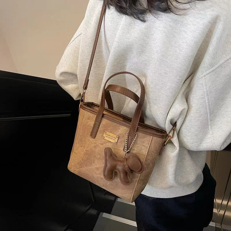 时尚百搭水桶包女2025春季新款休闲简约潮流斜挎包手提小包包C1