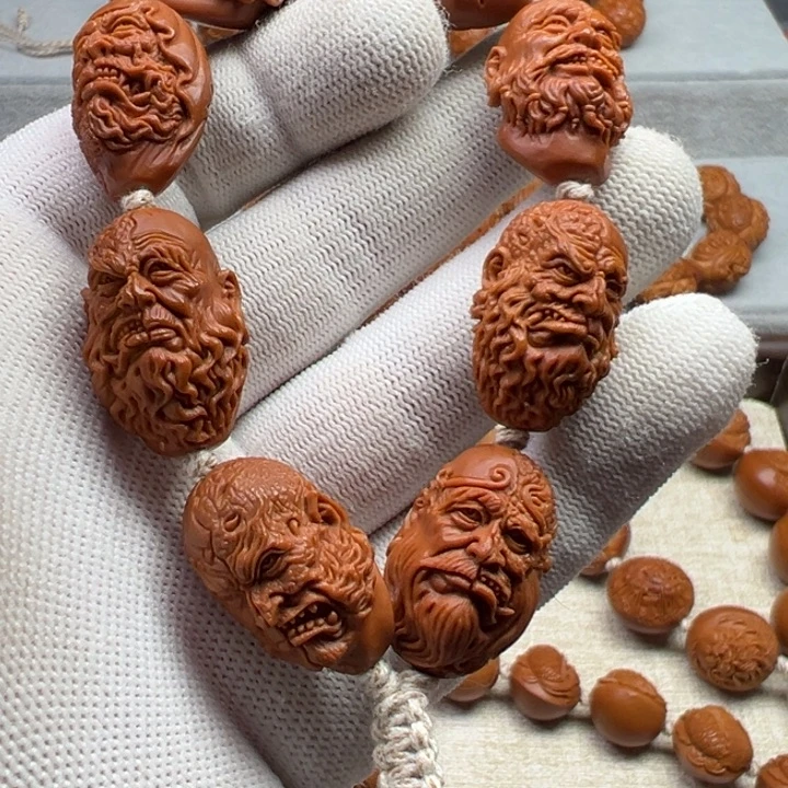 桐***桐橄榄核手串橄榄核雕工艺制作