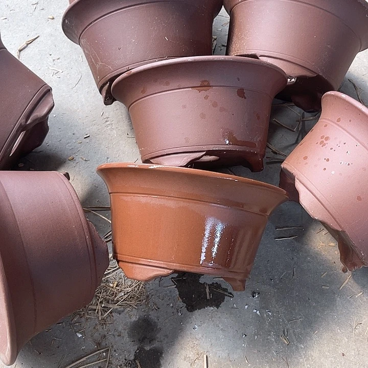 紫砂花盆100-8。  18-9