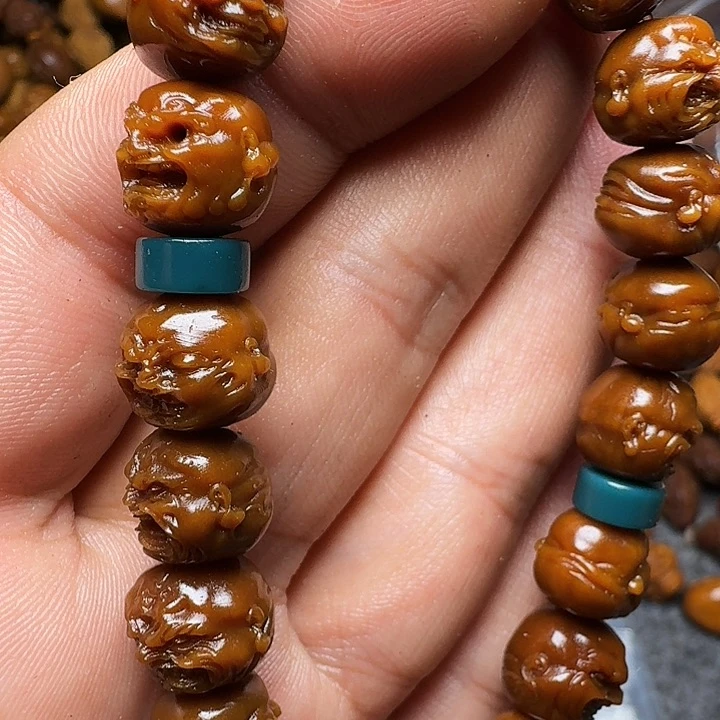 橄榄核把件你是谁