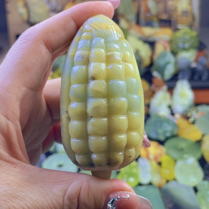 蛇纹石玉手把件合金