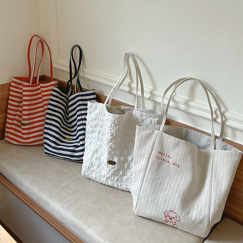 通勤帆布包女2025新款爆款双面背大容量单肩包百搭日常托特妈咪包