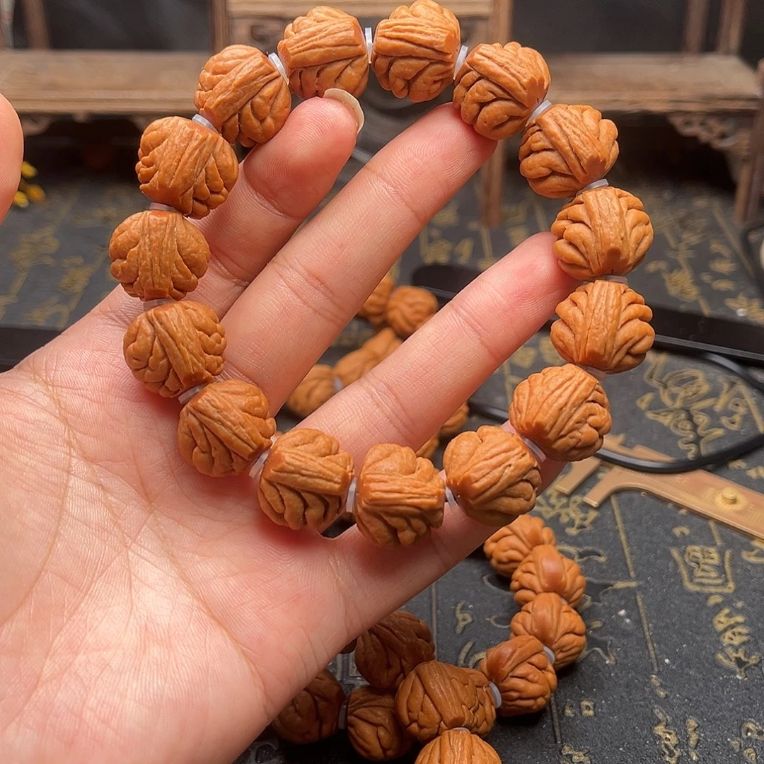 桃核吊坠包子头手串