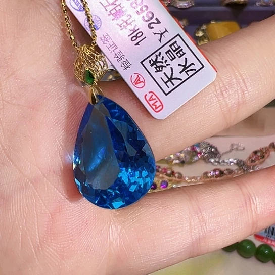 18K金镶嵌戒指托帕石喜**?