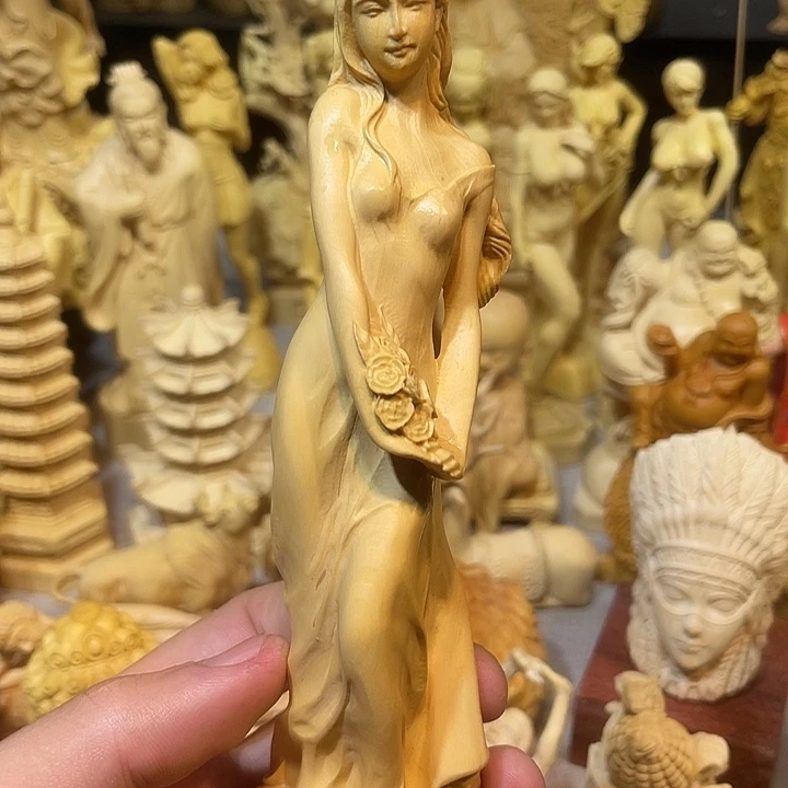 黄杨木黄杨木拿花美女