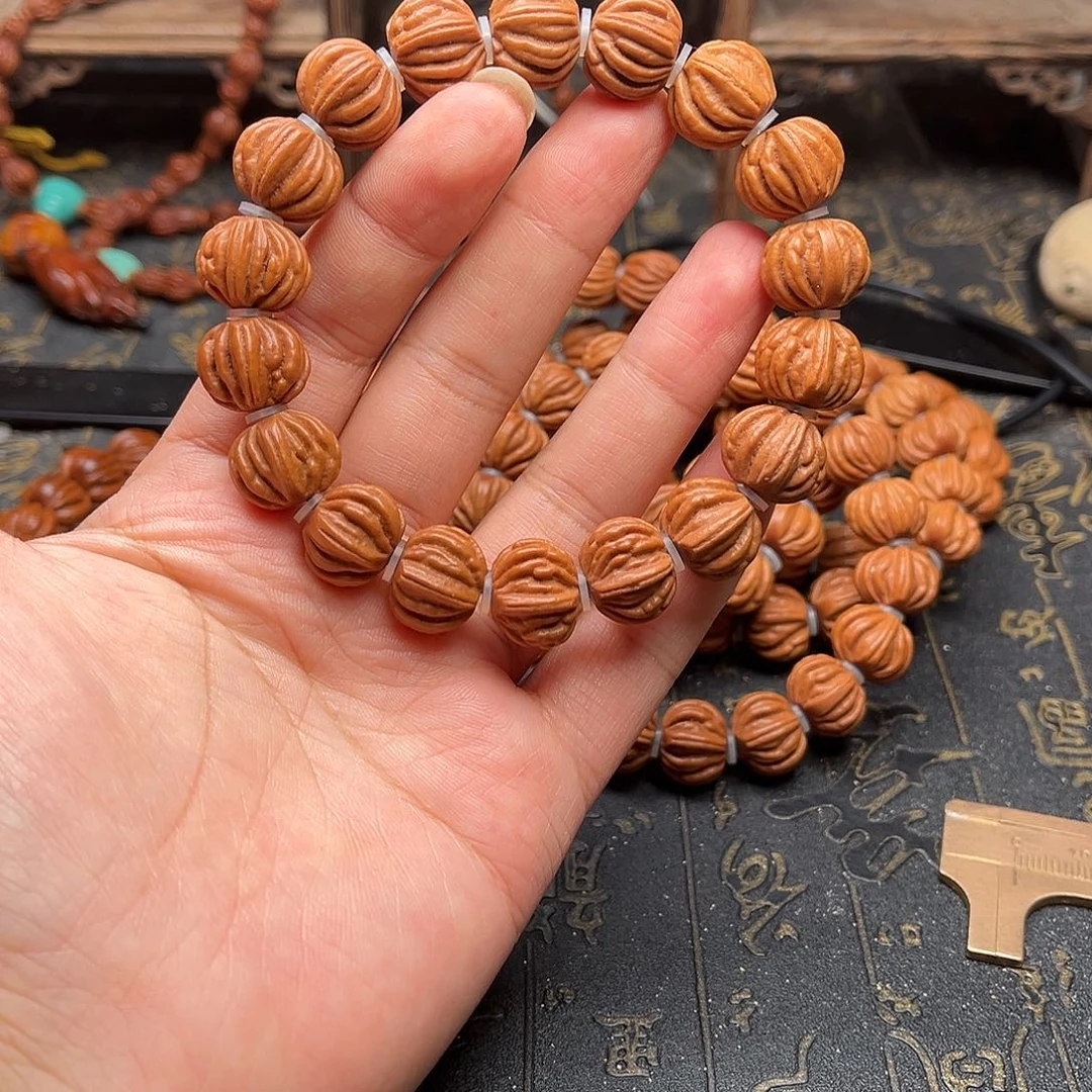 桃核吊坠佛手手串
