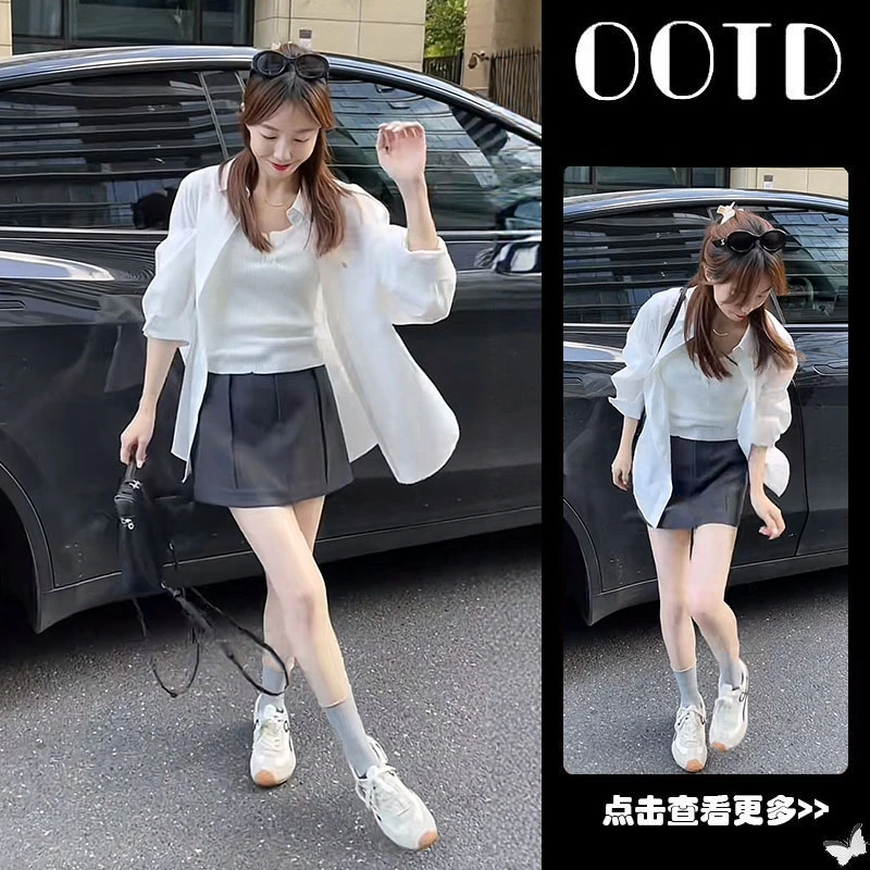 早秋流行穿搭一整套女2025新款白色衬衫针织背心百搭短裙三件套