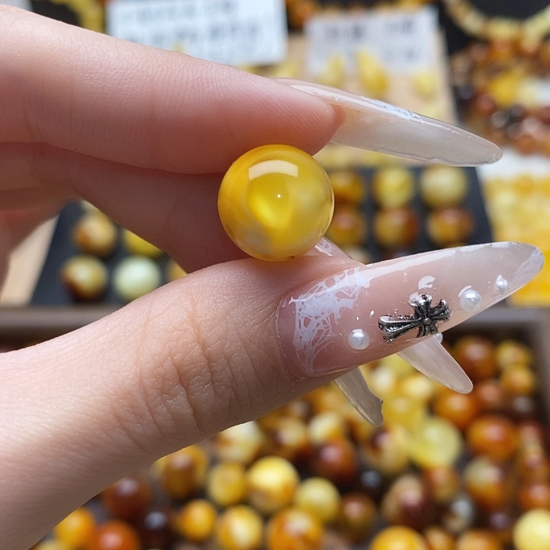 王***豆虫珀未镶嵌裸石蜜蜡