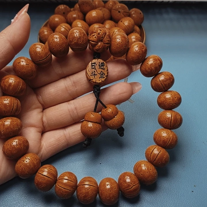 龍**神桃核手持17花皮色差21颗