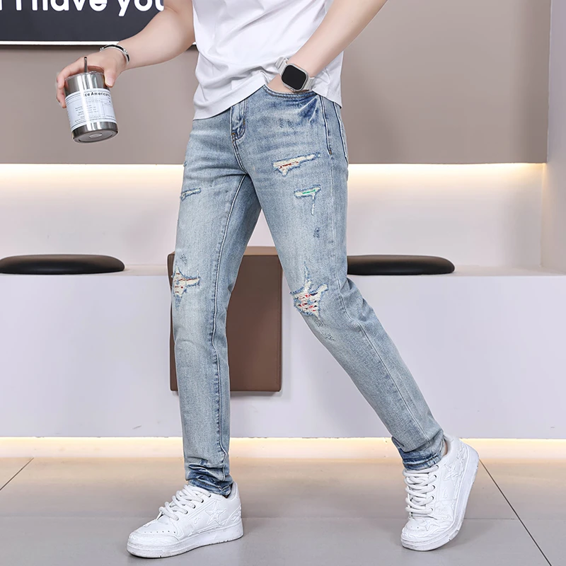 香港高端新款牛仔裤男修身小脚破洞刮烂补丁乞丐潮牌浅色裤子男