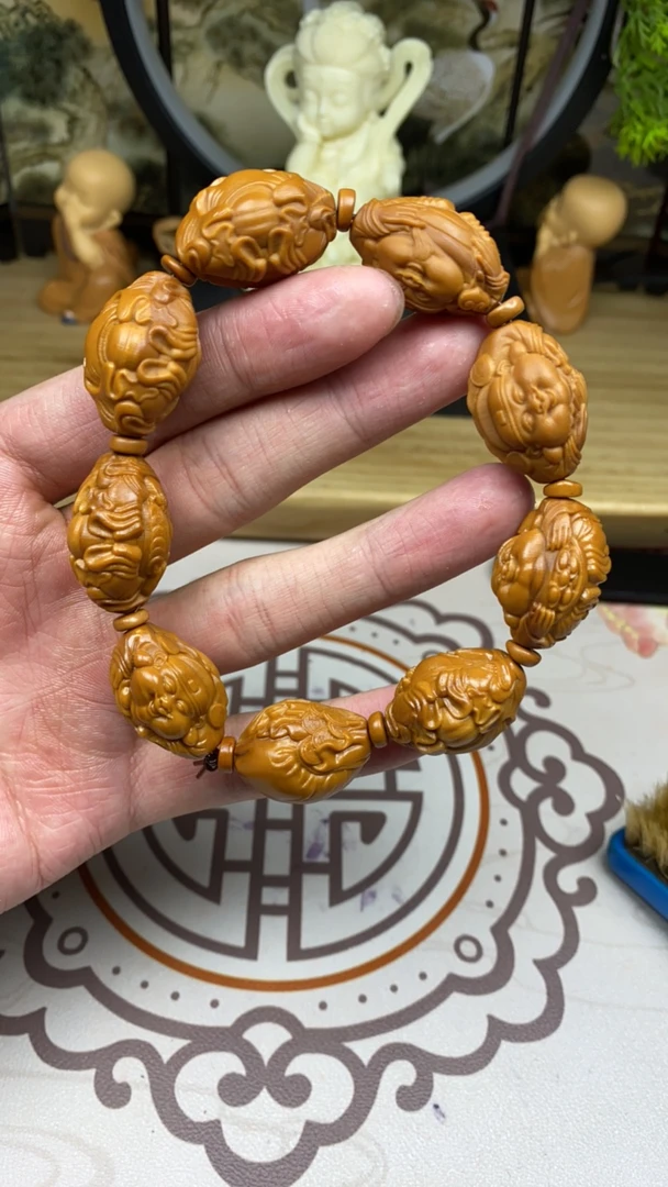 橄榄核雕工艺手串横财强