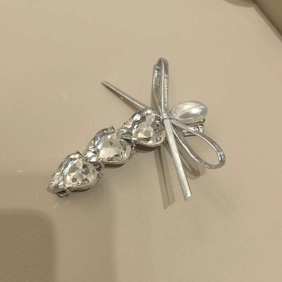 A353银色蝴蝶结弯刀爱心闪闪边夹