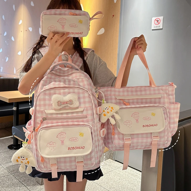 小清新格子书包女初中生轻便透气小学生高颜值减负双肩包中学生背