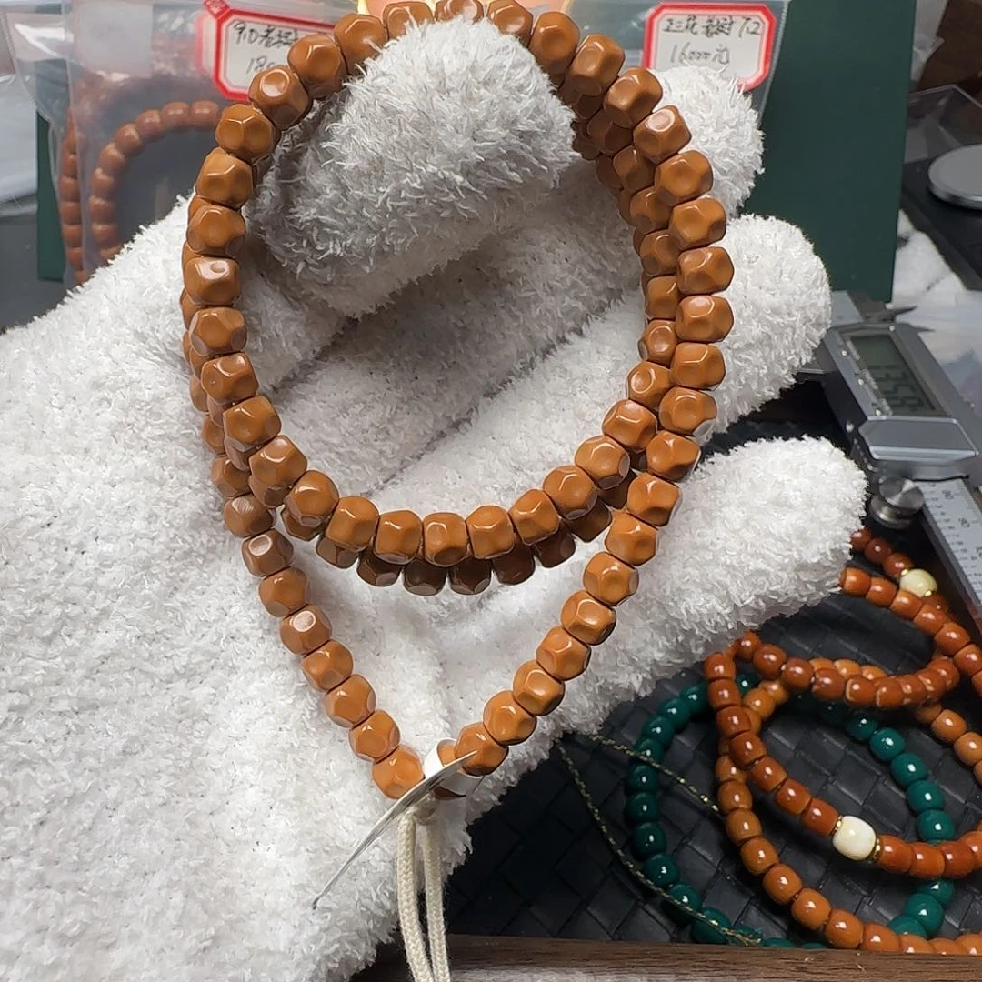 点***啊吊坠橄榄核6.6mm老挝核尖无相108