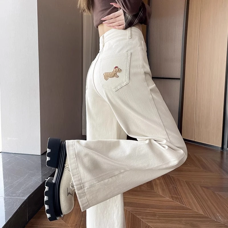 米白色卡通腊肠狗刺绣阔腿牛仔裤女2025秋冬新款网红窄版拖地裤子