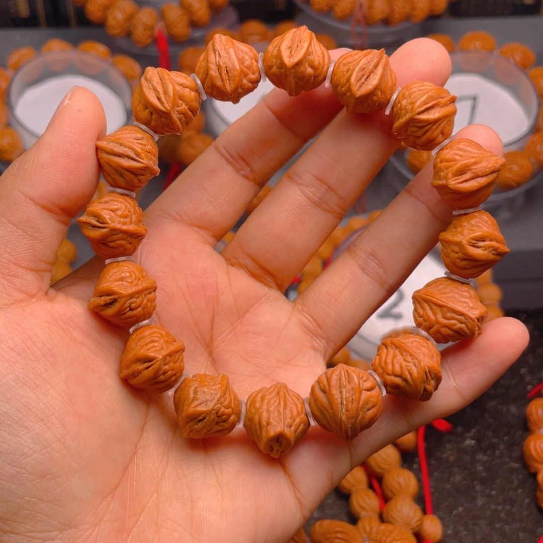 桃核手串生命之源扭转乾坤腰缠万贯