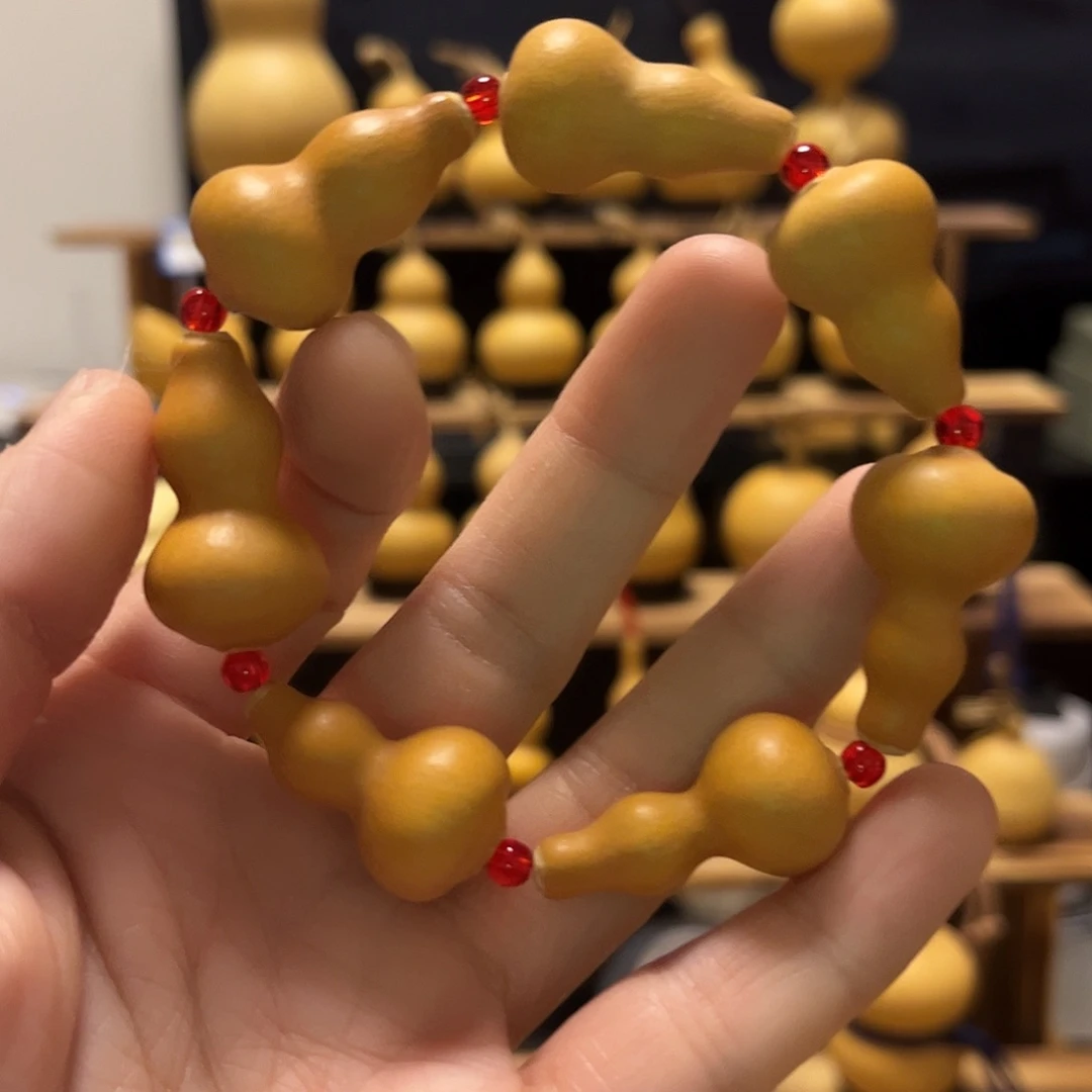 唔***然精品草里金葫芦手串