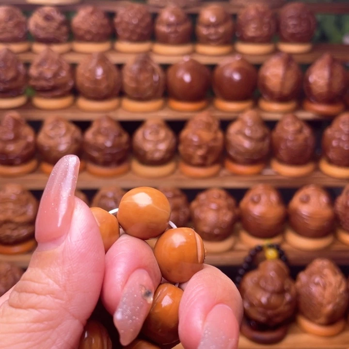 橄榄核把件青****?橄榄雕刻