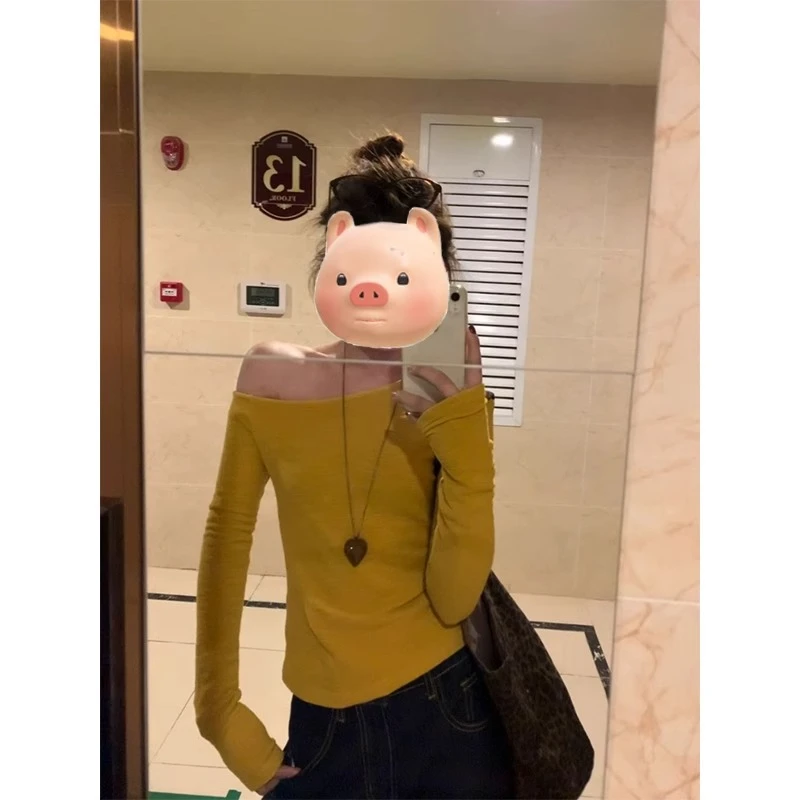 美式辣妹黄色斜肩长袖T恤女2025早春新款修身显瘦露肩设计感上衣