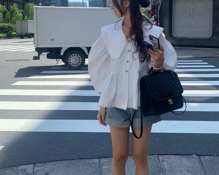 春季气质大翻领拼接镂空花边系带收腰不规则下摆长袖衬衫女8315