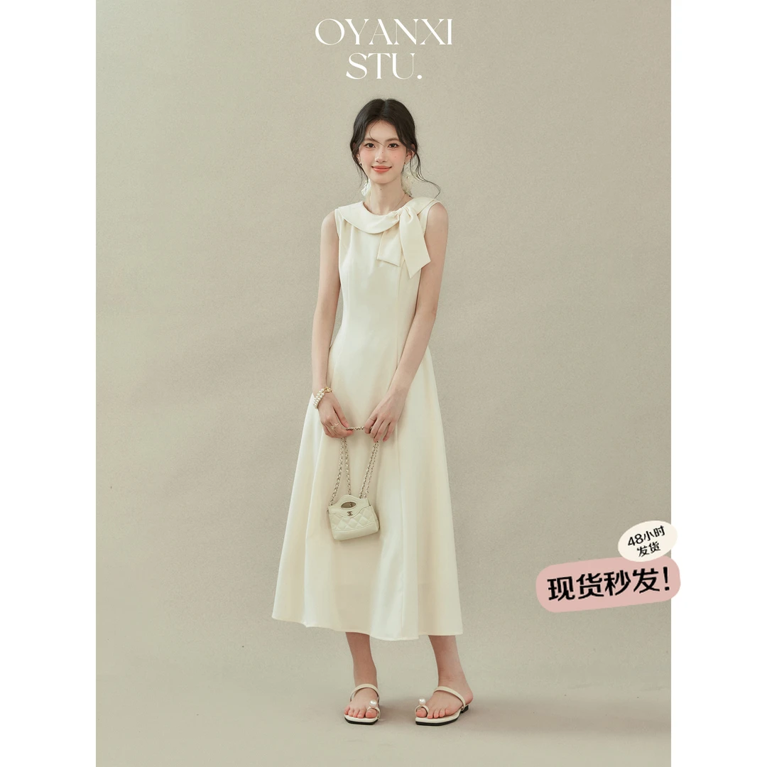 欧阳喜《典雅灰韵》法式杏色无袖蝴蝶结圆领连衣裙女夏季收腰长裙