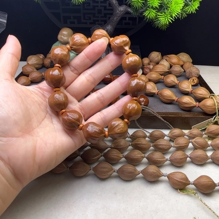 吴***谓手串/手链橄榄核1.9*2.0原皮三花蒜头铁核
