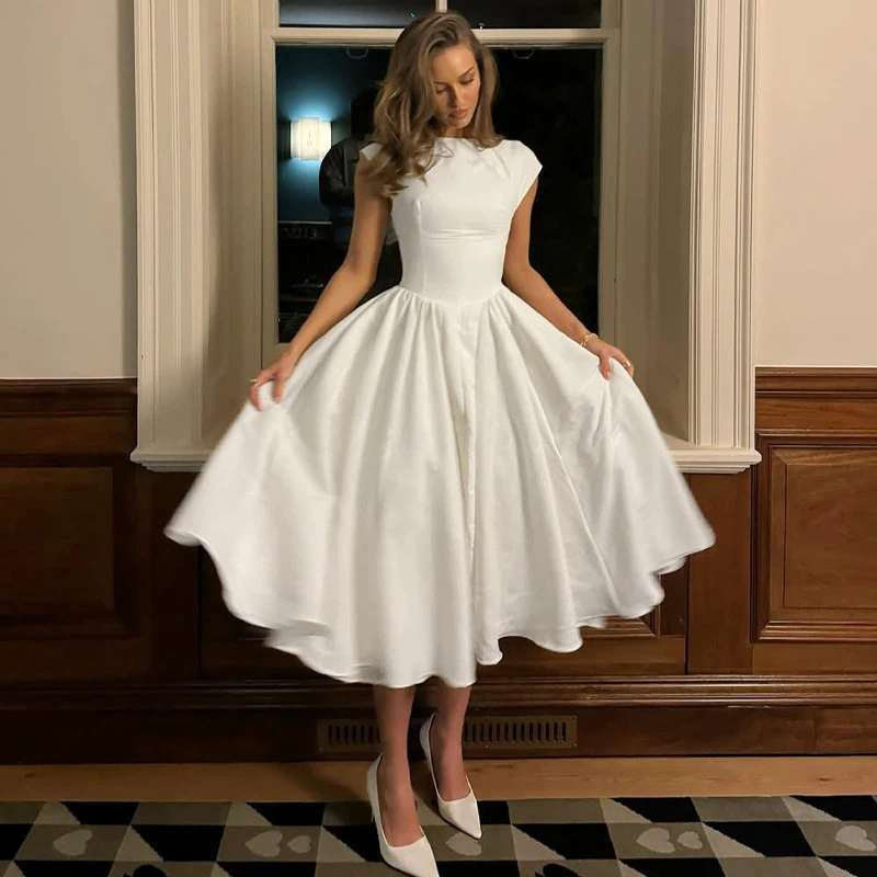 Dulzura春夏新款法式小众气质显瘦收腰一字领无袖露背连衣长裙