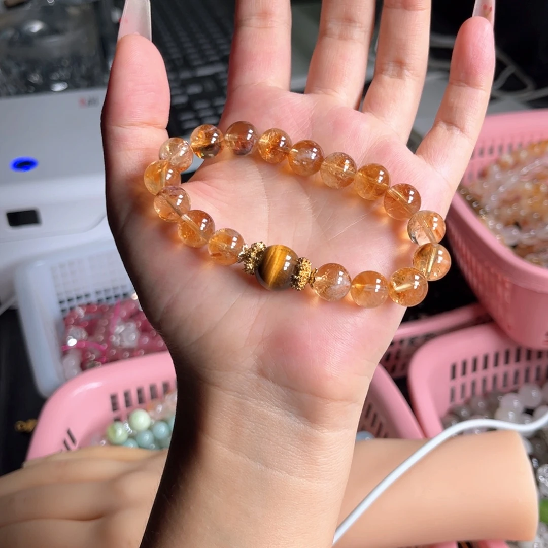 郑***亿未镶嵌手串水晶黄塔晶
