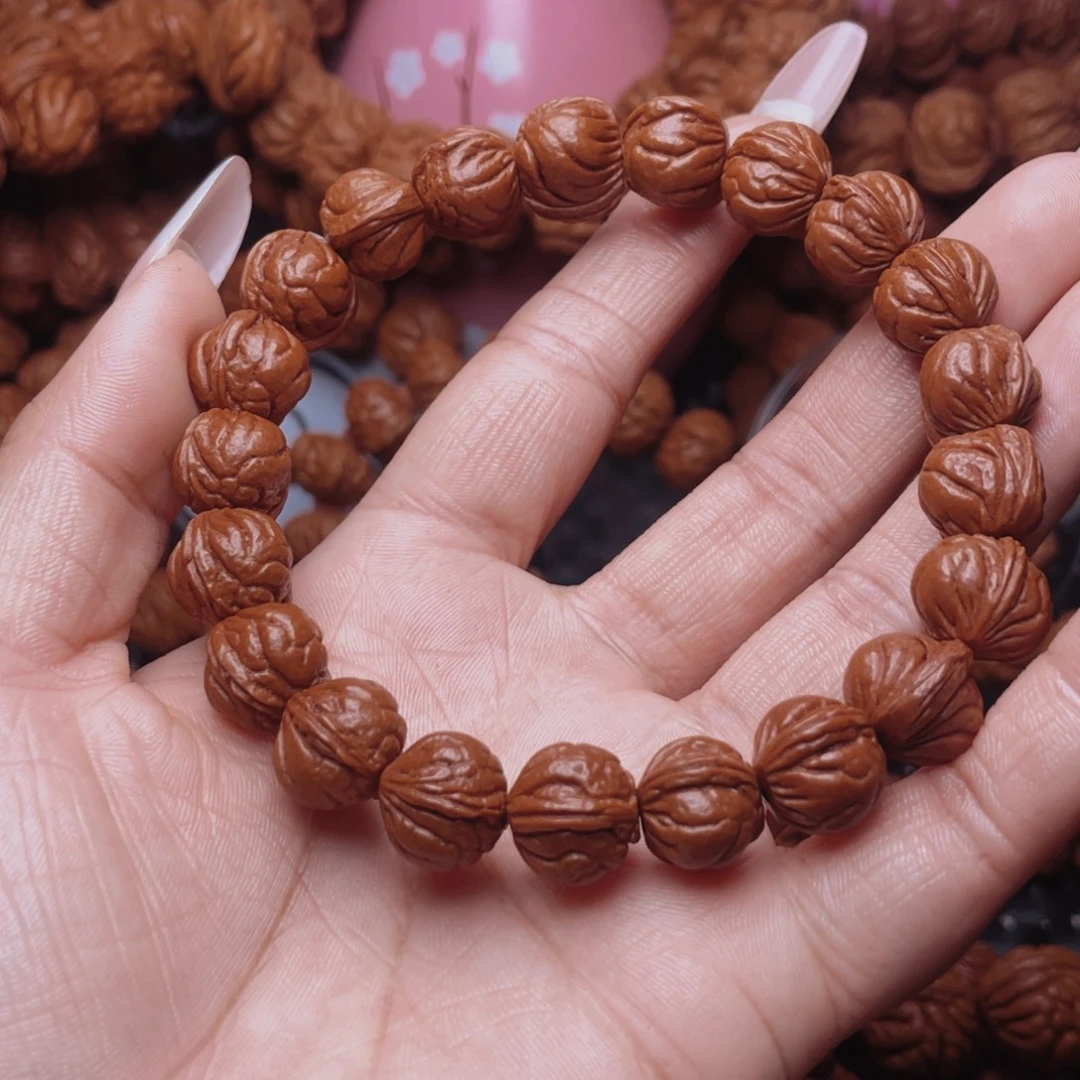 修***生把件文玩核桃龙纹桃核手串