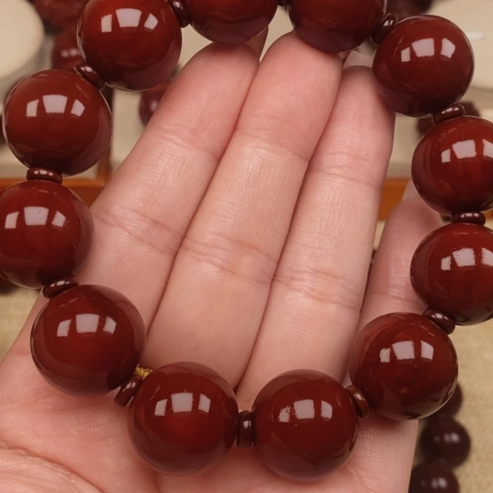 兆***司橄榄核吊坠正圆光珠