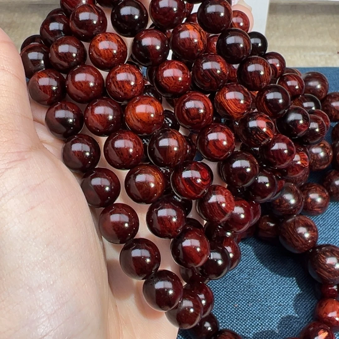 皓***空花梨木类手串/手链红降10圆珠满油单圈（瑕疵）