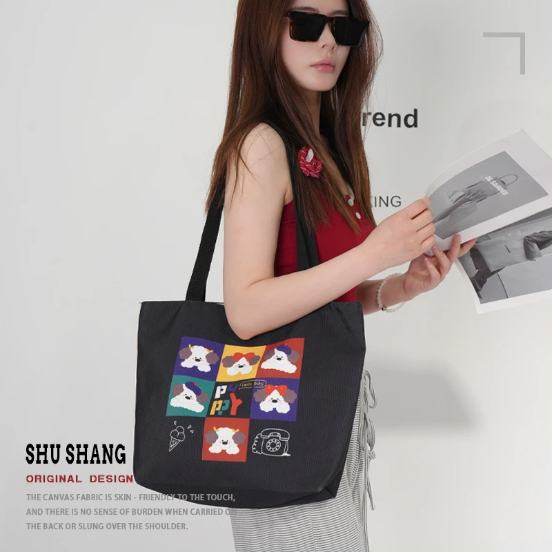 黑色涂鸦小狗简约卡通耐磨童话包包女款女士上班专用帆布包