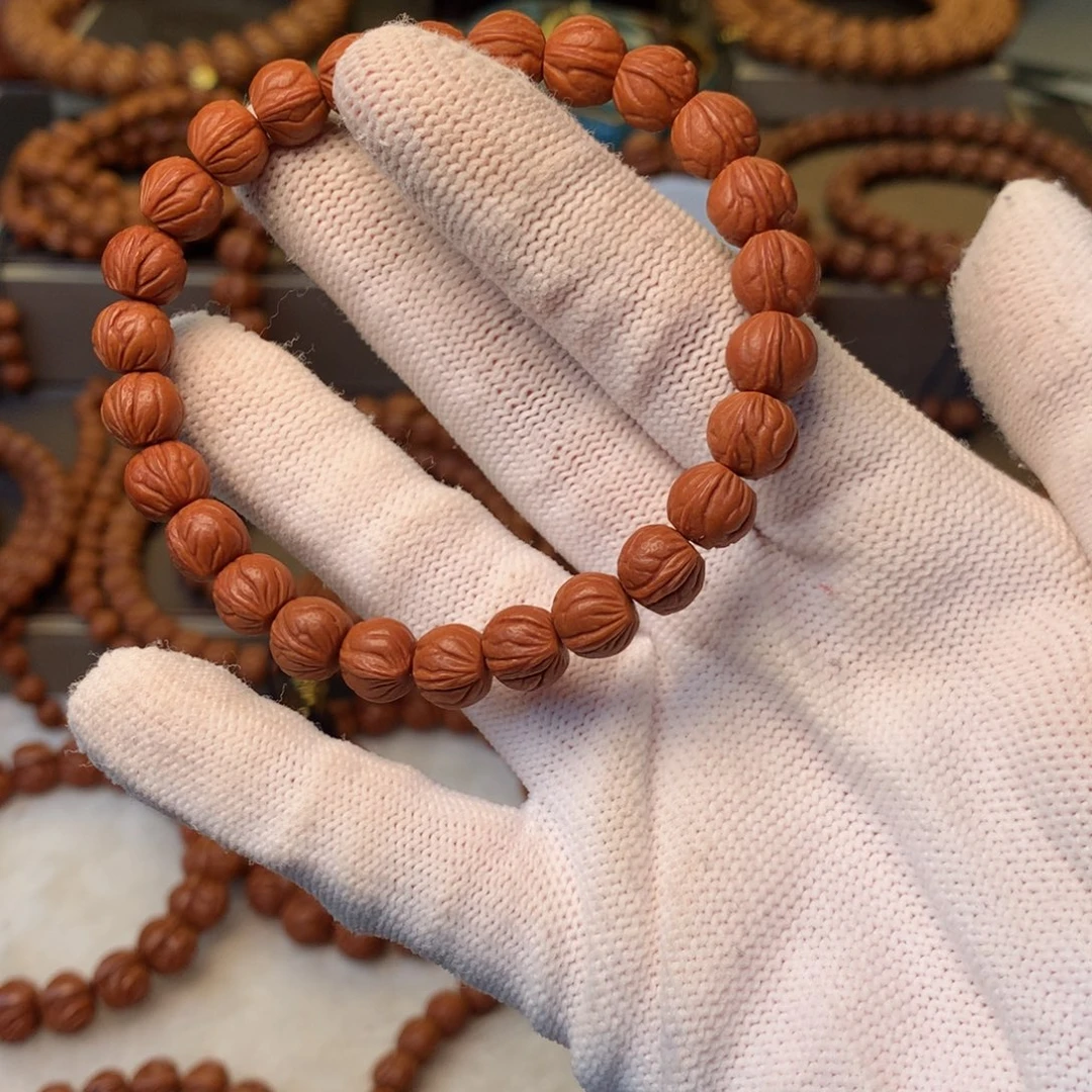 归***启手串桃核秦岭龙纹