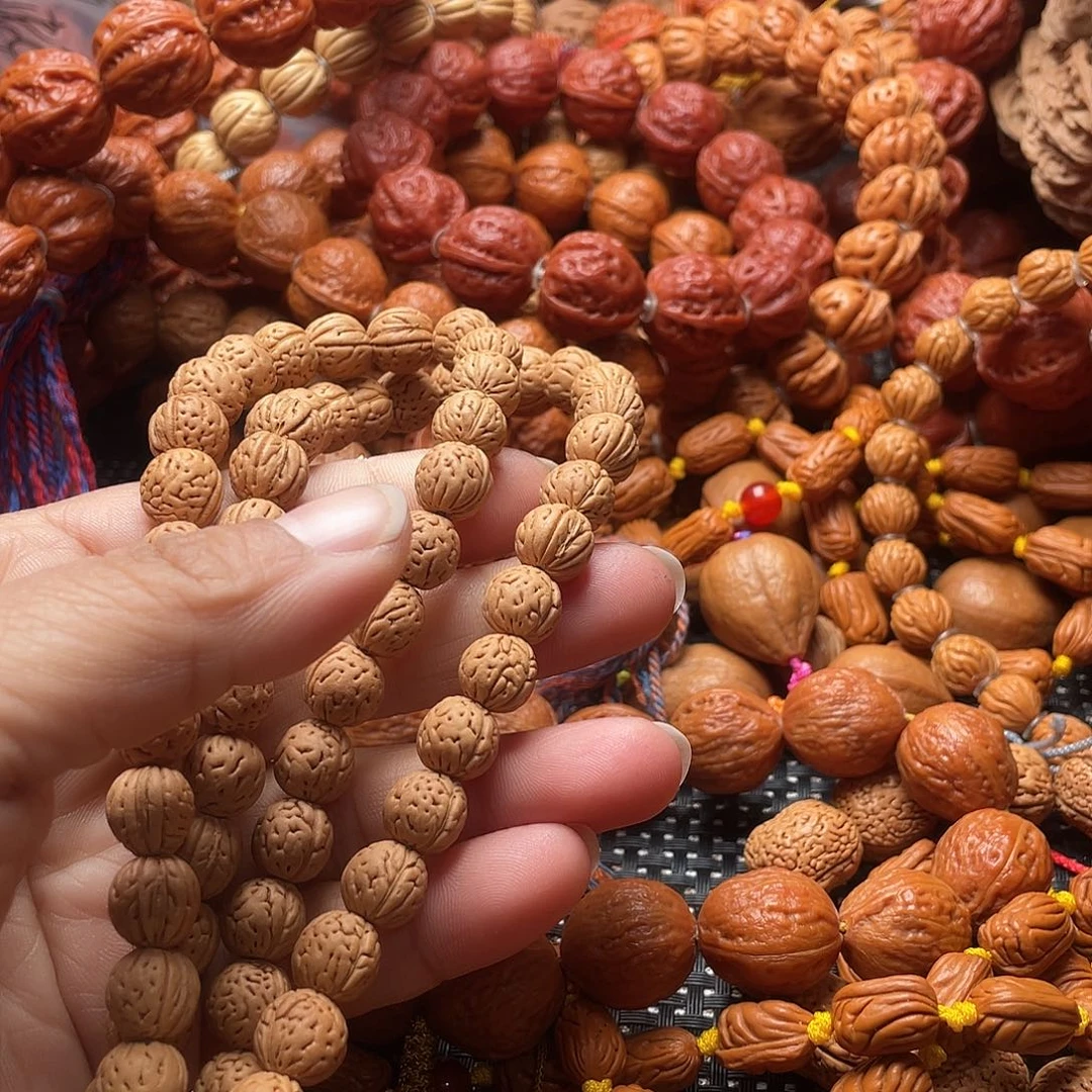 夕***花手串文玩核桃桃核