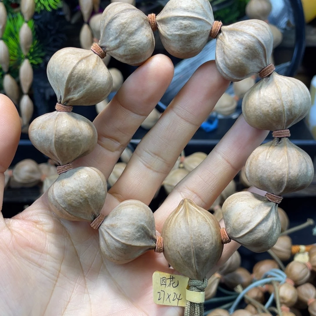 莫***初吊坠橄榄核2724铁核四花