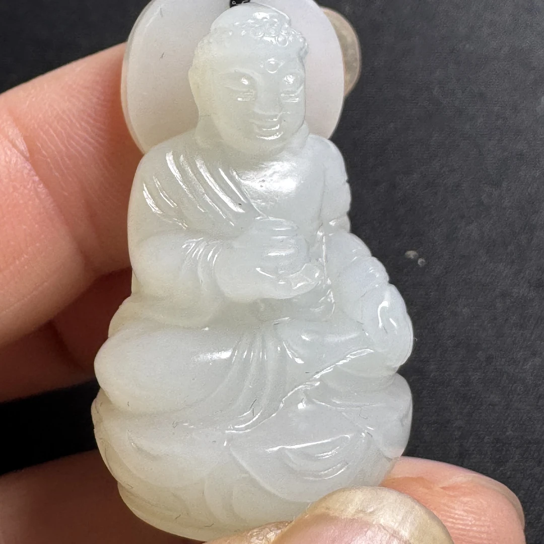 664-和田玉圆雕带皮释迦摩尼佛挂饰