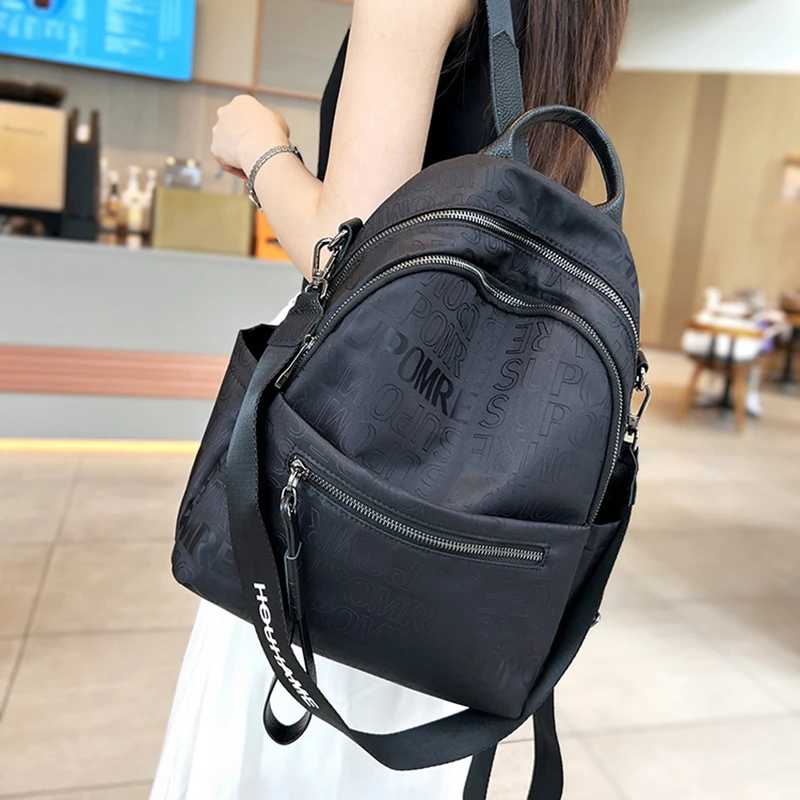 新款2025时尚大容量高级感字母双肩包女包洋气两用轻便背包旅行包