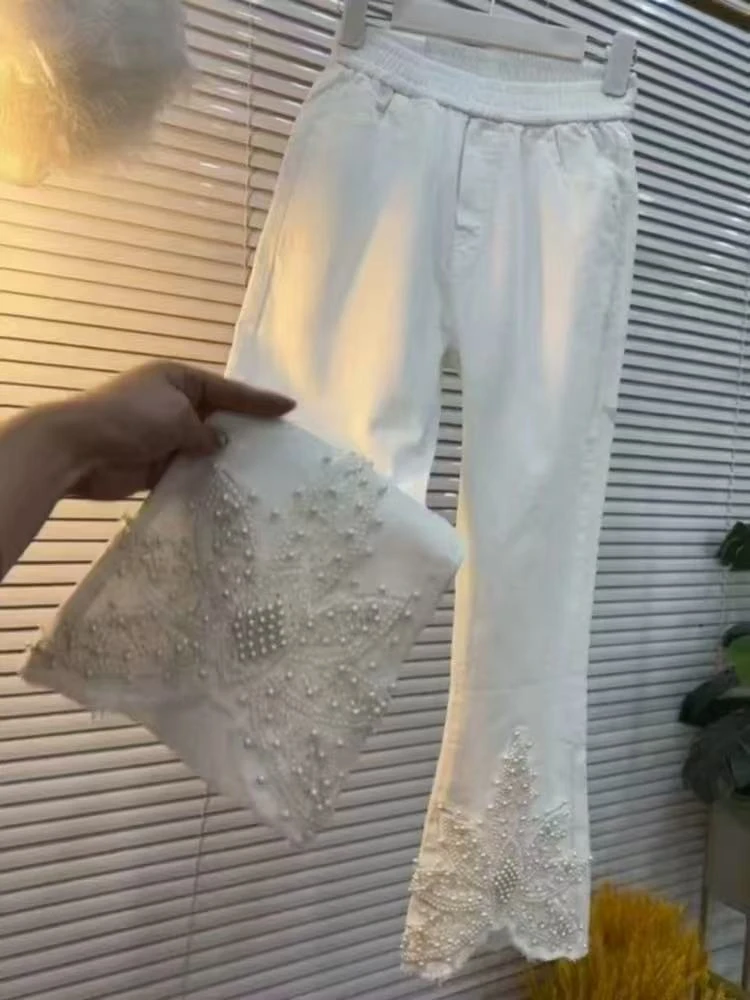 〖猫姐衣橱〗早春新款时尚高腰弹力重工串珠斜纹微喇裤99138